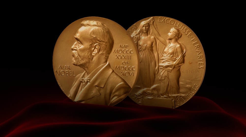 Nobel Prize Medal standing on a platform. Red and black background | 2 journalists win Peace Prize at just the right time | featured