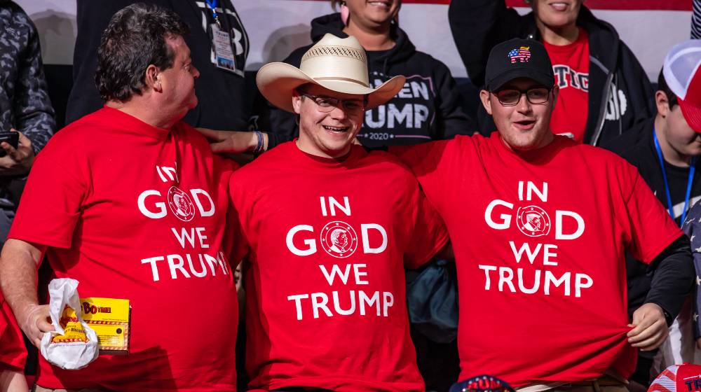President Trump supporters wearing faith in God and Trump shirts at the rally in the Bojangle's Coliseum | Trump Vows to Make America Great Again - Again | featured