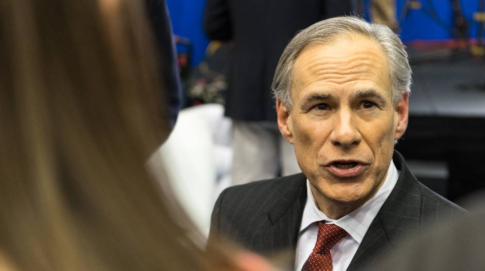Texas Governor Greg Abbott speaks to the media before the Republican National Committee debate | Greg Abbott, 9 Other GOP Governors Urge Return to Trump-Era Policies | featured