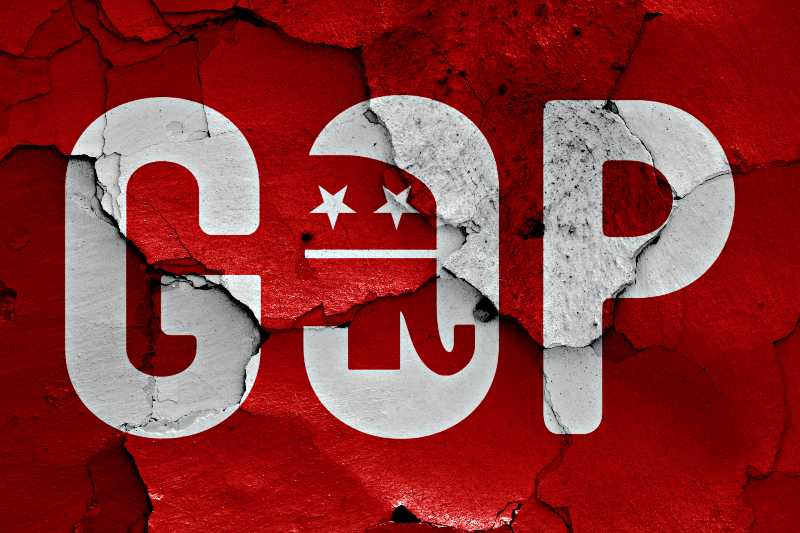 flag of GOP painted on cracked wall-Greg Abbott