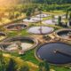 Aerial view of wastewater treatment plant, filtration of dirty or sewage water | Clean Water Act | The ‘Waters of the United States’ (WOTUS) Rule Would Expand EPA Regulatory Authority | featured