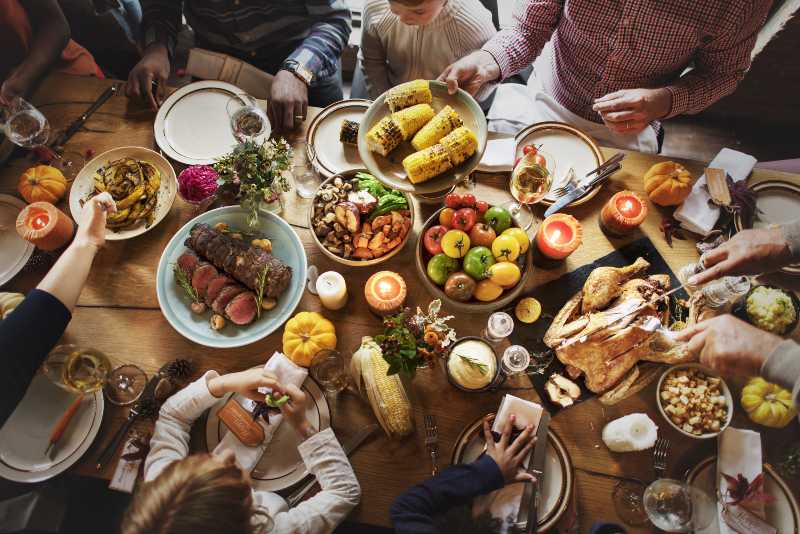People Celebrating Thanksgiving Holiday Tradition Concept-Thanksgiving dinner