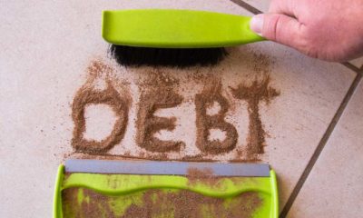 Sweep debt clean concept with debt written in dirt on a floor and a person is about to sweep the debt dirt | How To Get Out of Debt Without Losing Time and Money | featured