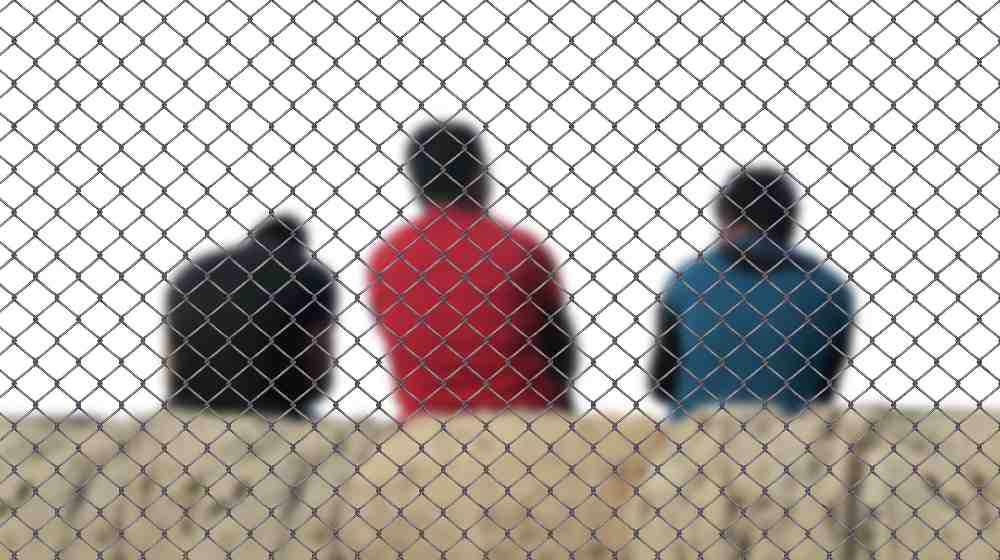 fence men refugee | Deportation orders from immigration judges plummet under Biden | featured