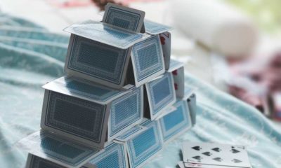 white and blue game cards on blue and white table | Kevin Spacey Ordered to Pay $31M To House of Cards Production Firm | featured