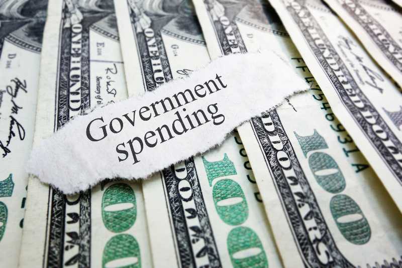 Government Spending newspaper headline on assorted money | Spending bill