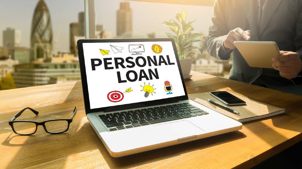 PERSONAL LOAN Thoughtful male person looking to the digital tablet screen | Are Online Personal Loans Good For People With Bad Credit? | featured