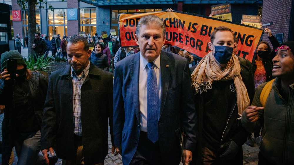 Senator Joe Manchin is confronted by climate activists | GOP To Welcome Joe Manchin If He Decides To Switch Sides | featured