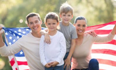 beautiful modern american family with USA flag outdoors | 18% of American Families Have Married Parents With Children | featured