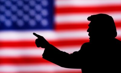 silhouette of Donald Trump against the background of the American flag | Trump Loses Appeal To Keep January 6 Documents Confidential | featured