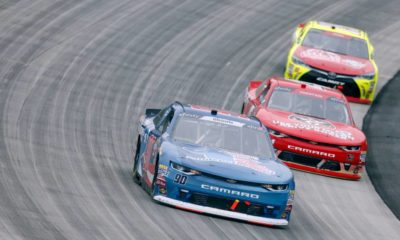 Brandon Brown (90) races through the field at the Bar Harbor 200 | Officials Rescind LGBcoin.io’s NASCAR Sponsorship For Brandon Brown | featured