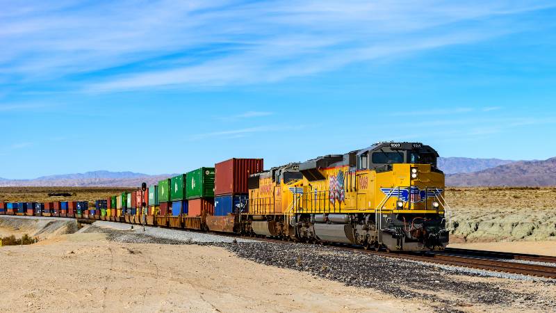 Cargo train passing by the desert in Palm Springs ,California | Union Pacific