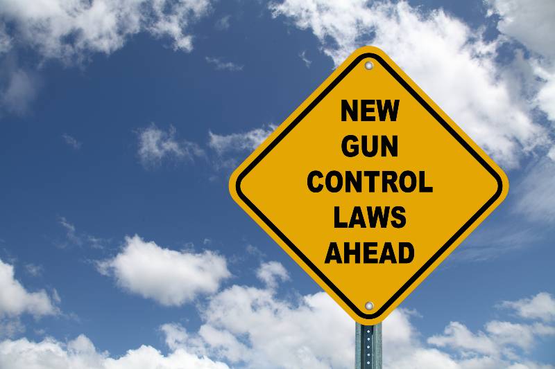 New Gun Control Laws Ahead yellow road sign | San Jose, California Approves Two New Gun Laws