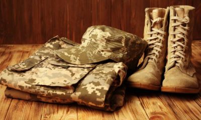 Set of military uniform on wooden background, close up view | Military Uniforms | The Importance of Uniforms in the Military | featured