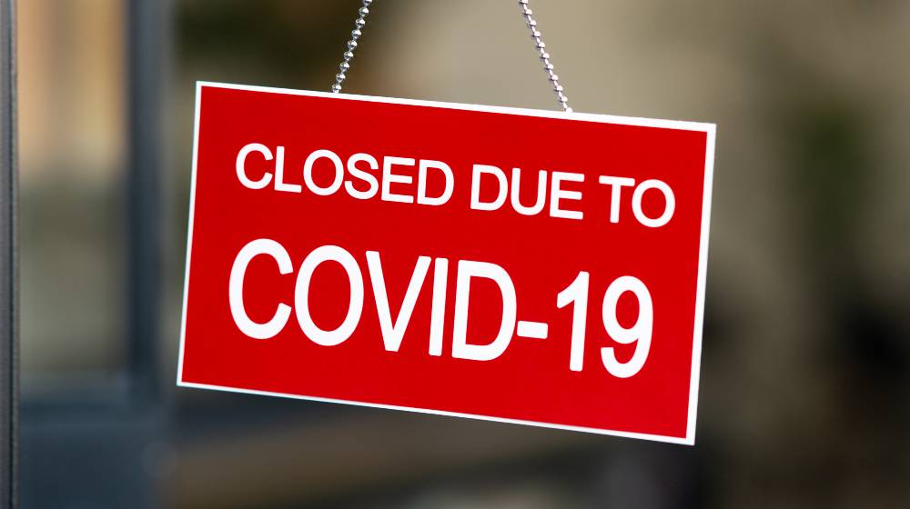 Temporarily closed sign for Covid-19 in small business activity | Businesses Struggle as Rising Omicron Cases Cause Worker Shortages | featured