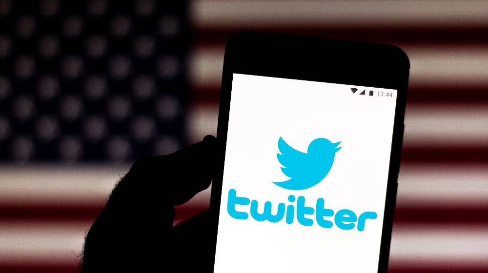Twitter logo is displayed on a smartphone | Twitter Bans Marjorie Taylor Greene’s Personal Account Permanently | featured