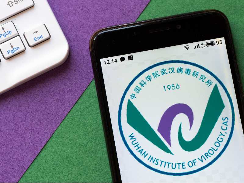 Wuhan Institute of Virology logo is seen displayed on a smartphone | Jim Jordan