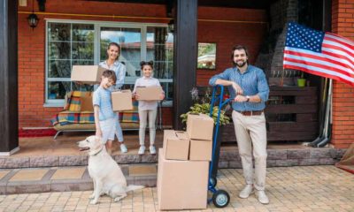 family with cardboard boxes and labrador dog | 600,000 People Left New York and California For Lower Tax States Such As Florida and Texas | featured