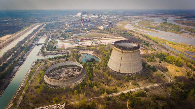 Aerial shot of Chernobyl nuclear reactors with straight canals around in spring | Ukraine, Chernobyl, George Floyd & more
