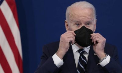 Joe Biden at a meeting putting his mask on while Supreme Court blocks Biden’s vax mandate | Americans Are Fed Up With Biden’s Pandemic Strategy | featured