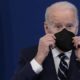 Joe Biden at a meeting putting his mask on while Supreme Court blocks Biden’s vax mandate | Americans Are Fed Up With Biden’s Pandemic Strategy | featured