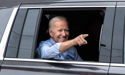 President Joe Biden points to the crowd outside of his first 2020 presidential campaign-Joe Biden-SS-Featured