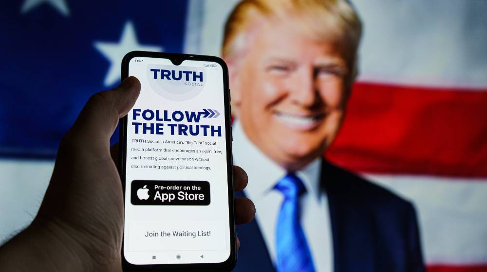Truth social media on smartphone. TRUTH Social is America’s “Big Tent” | Trump’s Truth Social A Rousing Hit, Becomes Top Downloaded App | featured