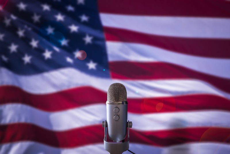 A Microphone In Front Of A USA Flag Ready | From President to House Speaker