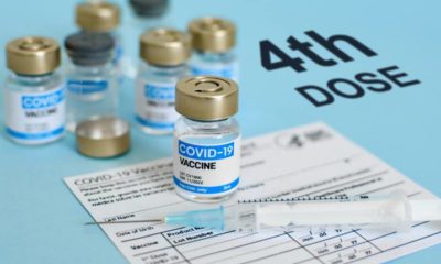 Close-up image of vaccine vial and syringe on CDC covid-19 vaccination record card Fourth | Fourth COVID Booster Necessary, According to Pfizer CEO