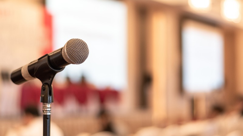 Microphone voice speaker in business seminar, speech presentation | Free Speech is Essential 