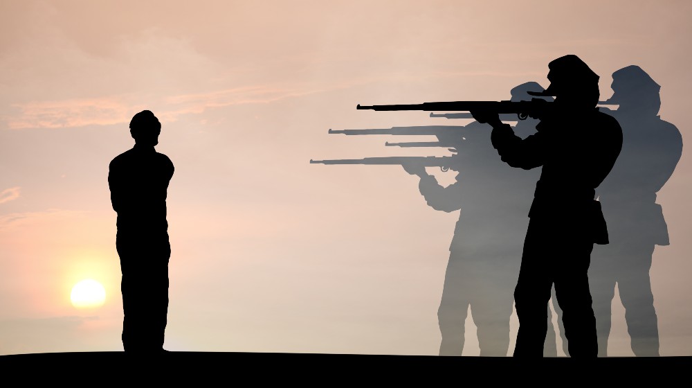 Silhouette of a detachment of military soldiers executing a criminal for the concept death by firing squad | Firing Squad Added To Execution Methods in South Carolina | featured