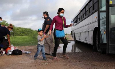 A Central American woman and her son who crossed the Rio Grande River illegally | Abbott To Drop Off Undocumented Texas Migrants At US Capitol | featured