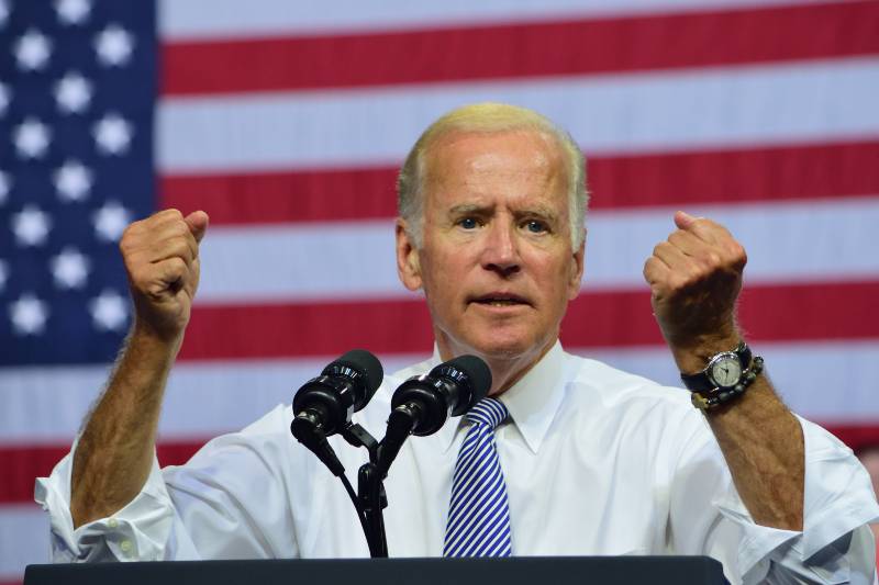 President Joe Biden makes a strong gesture while he delivers a speech | Federal Judge Prevents Biden Administration From Rescinding Title 42