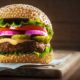 Tasty grilled delicious burger with lettuce | Burger King Sued For Making Whoppers Look Bigger in Ads | featured