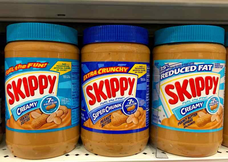 Three Jars of Skippy Peanut Butter on a store shelf | Skippy Issues Recall to Four Peanut Butter Variants