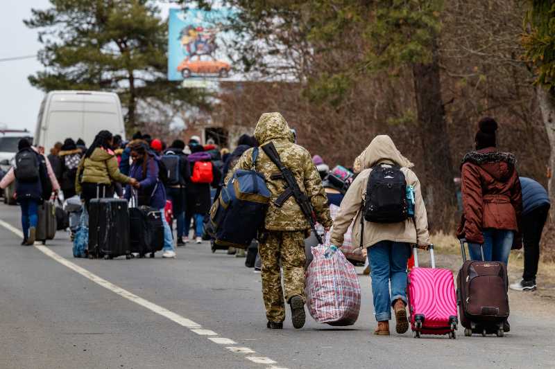 Ukrainian border guard helps to carry bags | No Need To Enter The US Through The South Border