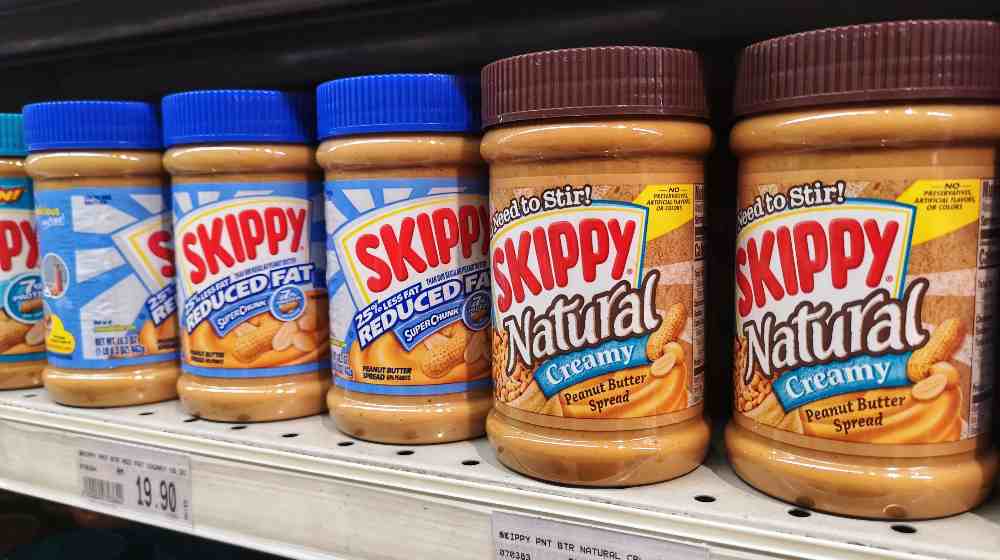 Upclose a Jars of SKIPPY brand peanut butter | Skippy Recalls 80.5 Tons of Peanut Butter Due To Metal Bits | featured