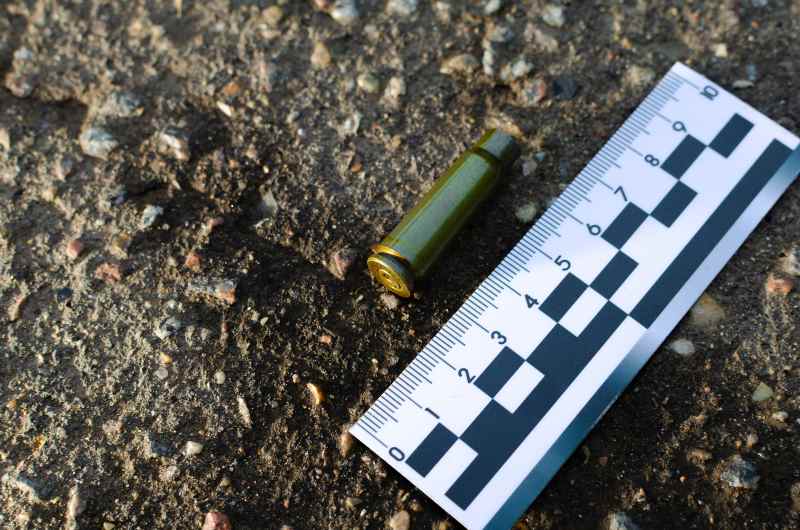 empty cartridge at the crime scene against the background of a forensic ruler | Sacramento Shooting Leaves 6 Dead, 12 Wounded