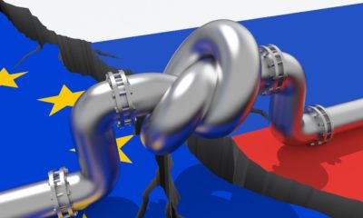 Fuel-gas-pipeline-with-a-knot-on-background-of-European-Union-and-Russian-flags-Russian-Oil-Ban-SS-Featured