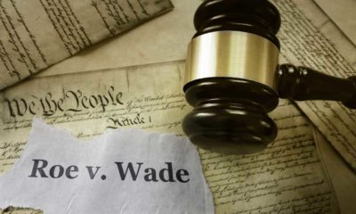 Roe v Wade news headline with gavel on a copy of the United States Constitution | SCOTUS to Overturn Roe v. Wade, Finally End Abortion Rights | featured