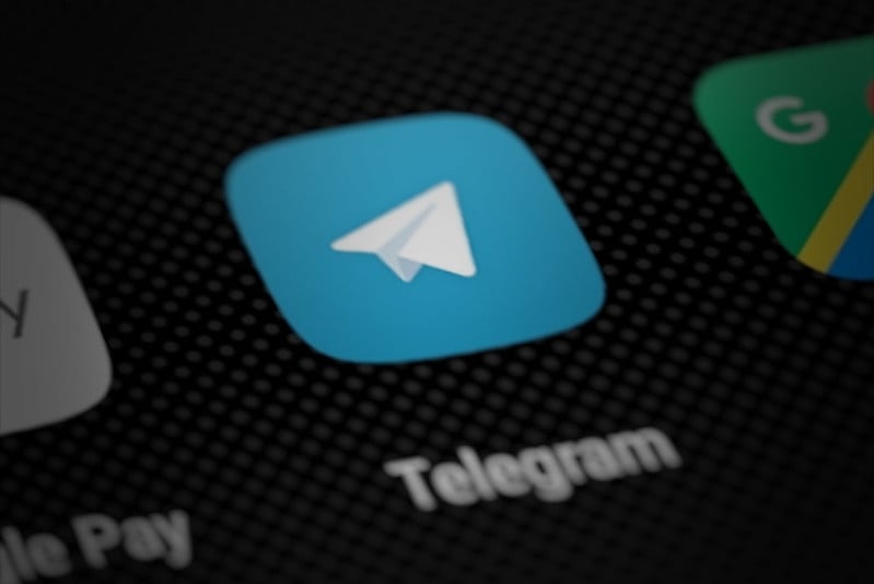 Telegram app icon on smartphone screen (perspective render)