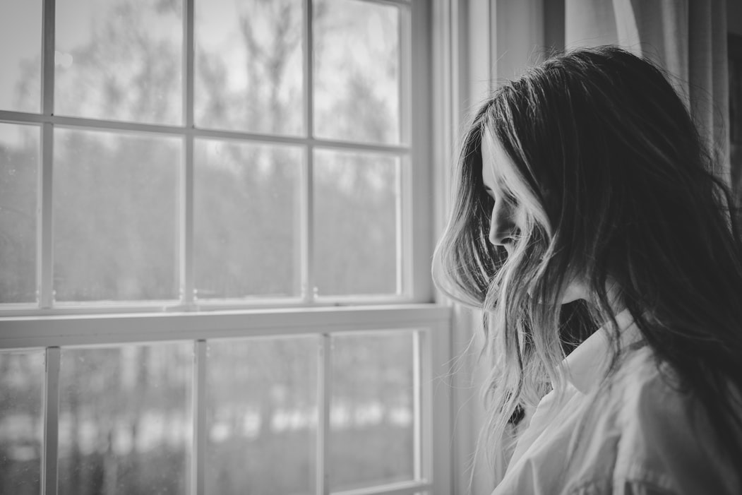 woman looking stress | Mind Over Matter: Anti-Stress Tips for Anti-Aging | Featured