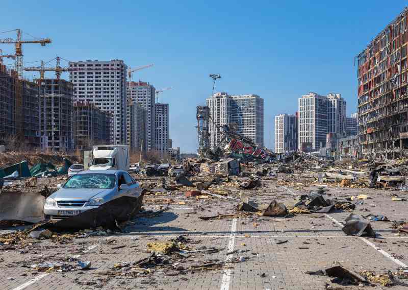 A civilian site destroyed by russian bombs, the Retroville Trade Center in Kyiv | Biden Accuses Putin Of Committing Genocide in Ukraine