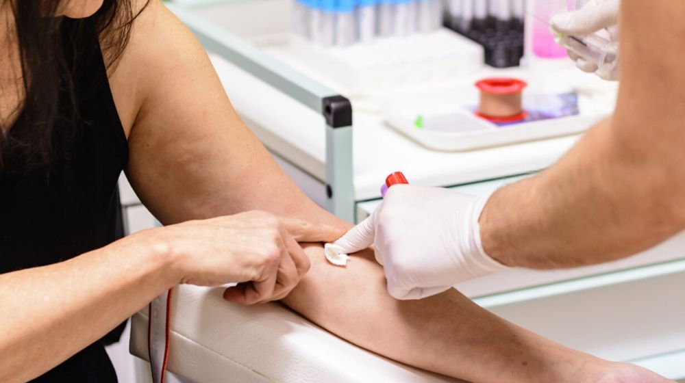 blood collection to a lady | Washington Orders No Deductibles, Co-pays for Coronavirus Visits and Testing on Some Health Plans | Featured