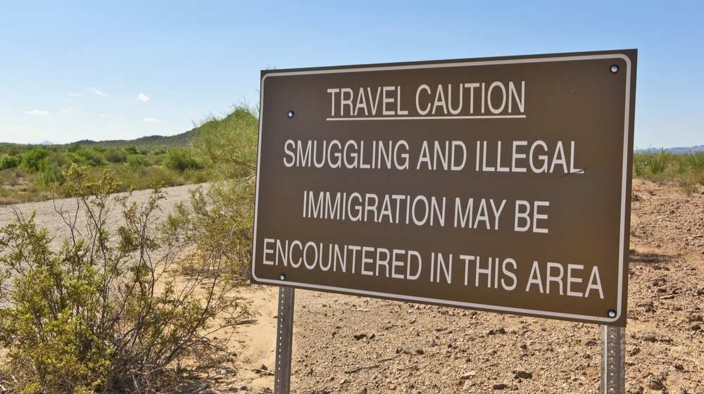 A warning sign in the Arizona desert-Biden Border Crisis Continues 80 Migrant Minors Crossing Arizona Desert-ss-featured