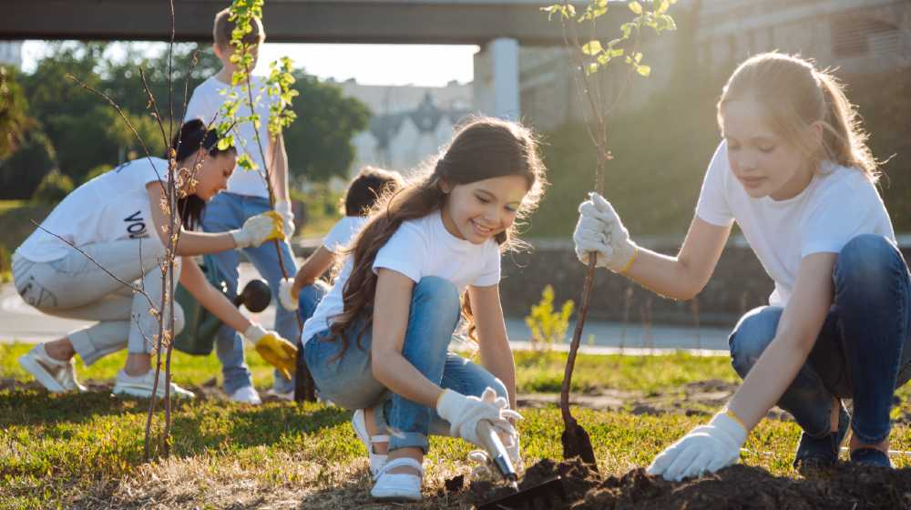 Adolescents working in volunteer group | Ways to Get Your Child Involved in Serving in Their Community | featured