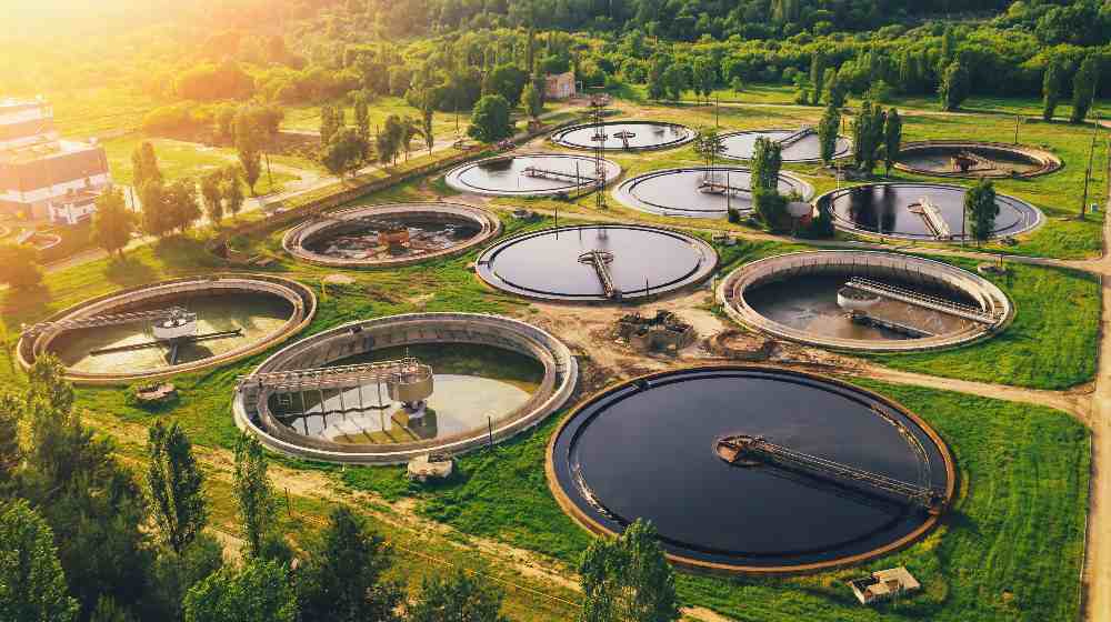 Aerial view of wastewater treatment plant, filtration of dirty or sewage water | Clean Water Act | The ‘Waters of the United States’ (WOTUS) Rule Would Expand EPA Regulatory Authority | featured