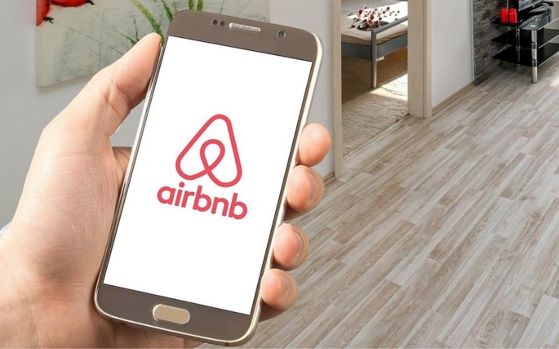 Airbnb Logo on a Smartphone | Airbnb and Alice Cooper Team up for “Spooky Story Time with Alice Cooper”