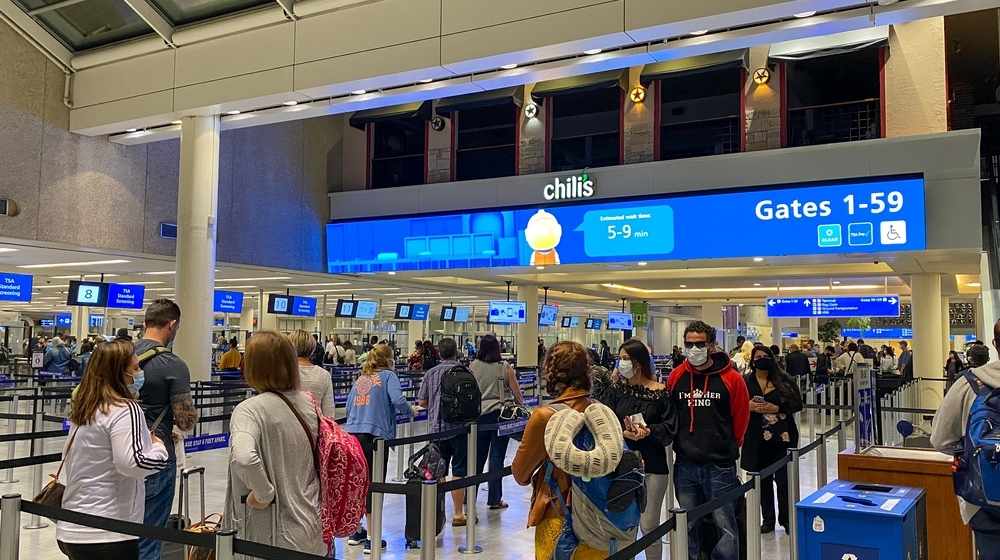 An airport gate in Orlando-Travelers Not Wearing Masks Could Receive a $1,500 Fine-ss-Featured