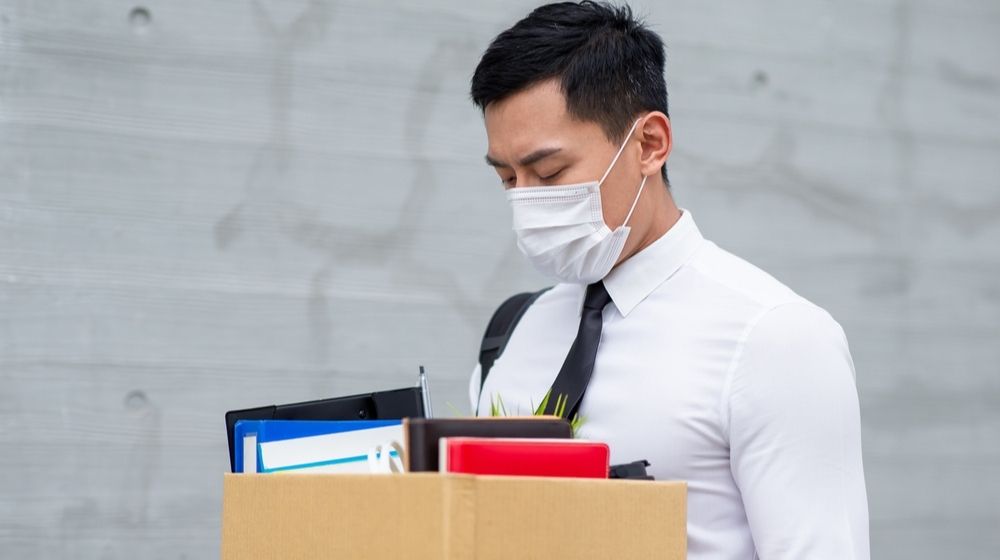 Asian Businessman Wearing Face Mask | U.S. Unemployment Rate Drops to 11.1 Percent Last Month | Featured